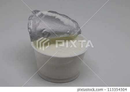Prepackaged sour cream mayonnaise in a plastic bucket. Ready to eat. 113354304