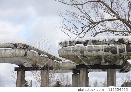 The main provides the city with hot water. Selective focus. The pipes of the central heating system The main provides the city with hot water. Selective focus. The pipes of the central heating system 113354433