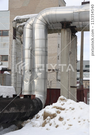 The main provides the city with hot water. Selective focus. The pipes of the central heating system The main provides the city with hot water. Selective focus. The pipes of the central heating system 113354540