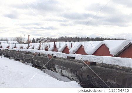 The main provides the city with hot water. Selective focus. The pipes of the central heating system The main provides the city with hot water. Selective focus. The pipes of the central heating system 113354750