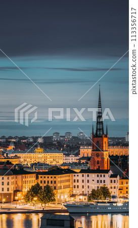 Stockholm, Sweden. Scenic View Of Stockholm Skyline At Summer Evening. Famous Popular Destination Scenic Place In Dusk Lights. Riddarholm Church In Night Lighting Stockholm, Sweden. Scenic View Of Stockholm Skyline At Summer Evening. Famous Popular Destination Scenic Place In Dusk Lights. Riddarholm Church In Night Lighting 113356717