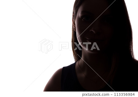 Young woman look ahead with flowing hair - isolated silhouette of a front view 113356984