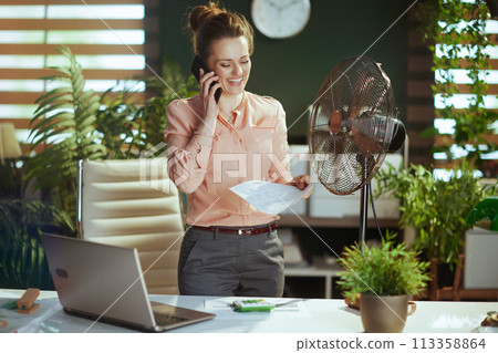 smiling 40 years old accountant woman at work talking on phone 113358864