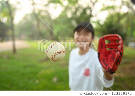 School girl in baseball glove catching a ball. Sports and youth lifestyle concept School girl in baseball glove catching a ball. Sports and youth lifestyle concept 113359173