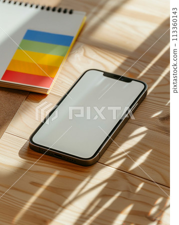 Close up of mobile phone on desktop with planning 113360143