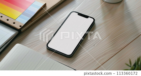 Close up of mobile phone on desktop Close up of mobile phone on desktop 113360172