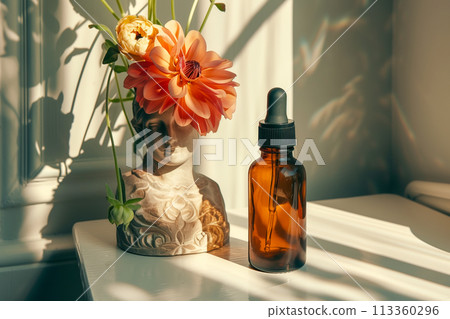A vase with a flower on top of it and a bottle of oil next to it A vase with a flower on top of it and a bottle of oil next to it 113360296