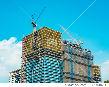 Buildings under construction and blue sky and white clouds 113360611