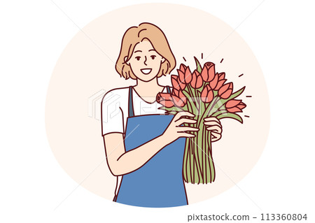 Positive woman flower seller stands with luxurious bouquet and smiling looks at camera 113360804