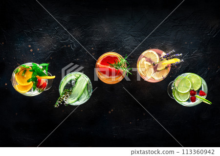 Fancy cocktails with fresh fruit. Gin and tonic drinks with ice at a party 113360942