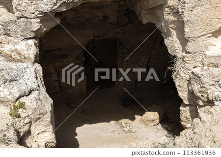 Shadowed Cave Entrance at Paphos Archaeological Park 113361936