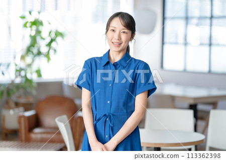 Woman wearing a blue dress Woman wearing a blue dress 113362398