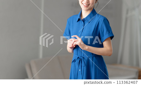 Woman wearing a blue dress Woman wearing a blue dress 113362407