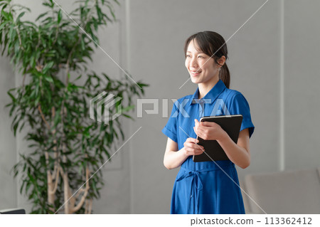 Woman wearing a blue dress Woman wearing a blue dress 113362412