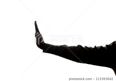 Man's hand shows stop, denial, disagreement - silhouette 113363682