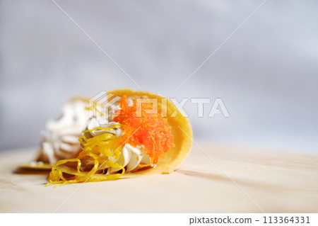 Thai Crispy Pancake (Kanom Buang) on wooden plate isolated on white background Thai Crispy Pancake (Kanom Buang) on wooden plate isolated on white background 113364331
