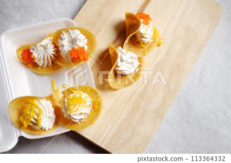 Thai Crispy Pancake (Kanom Buang) on wooden plate and foam box isolated on white background Thai Crispy Pancake (Kanom Buang) on wooden plate and foam box isolated on white background 113364332