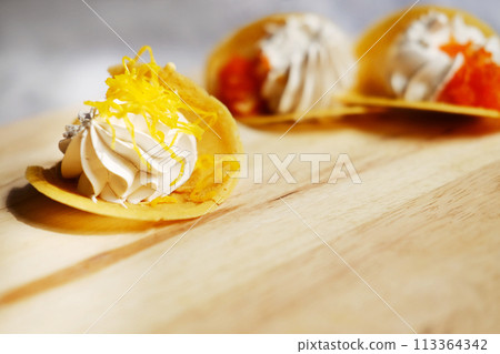 Thai Crispy Pancake (Kanom Buang) on wooden plate isolated on white background 113364342