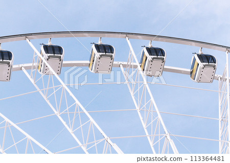 Ferris wheel against on blue sky. Ferris wheel against on blue sky. 113364481