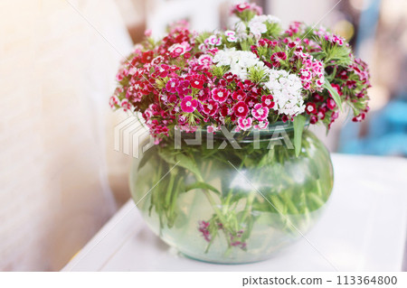 Bouquet Pink Flowers in Glass jar and water in glass vase. Bouquet Pink Flowers in Glass jar and water in glass vase. 113364800
