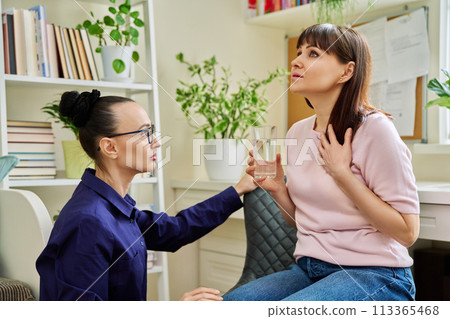 Female psychologist working individually with mature woman patient in office 113365468
