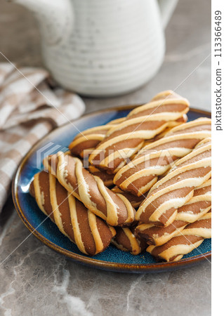 Classic Striped Cookies on plate on kitchen table. Classic Striped Cookies on plate on kitchen table. 113366489