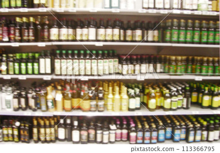 Olive oil sales display in an Italian supermarket Olive oil sales display in an Italian supermarket 113366795