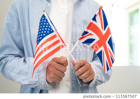 Learn English language, Asian teenage student hold book with flag in course at school. 113367507