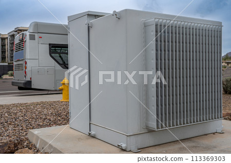 Selective focus on an electric transformer outside a commercial building. Selective focus on an electric transformer outside a commercial building. 113369303