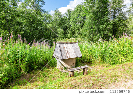 Traditional wooden water well at the countryside in summer Traditional wooden water well at the countryside in summer 113369746