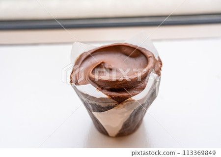 Closeup double chocolate cupcake, the chocolate frosting over chocolate cupcake. 113369849