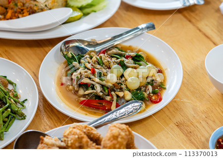 Stir fried spicy catfish roe and Razor clam with Thai herbs Stir fried spicy catfish roe and Razor clam with Thai herbs 113370013