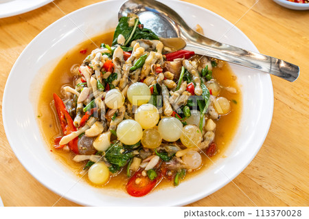 Stir fried spicy catfish roe and Razor clam with Thai herbs Stir fried spicy catfish roe and Razor clam with Thai herbs 113370028