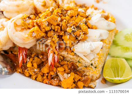 Delicious seafood thai fried rice (crab meat, shrimp, crab roe and squid) closeup 113370034