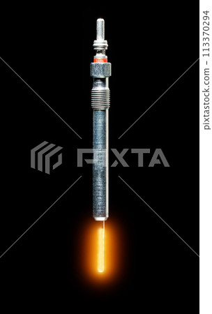 Modern glow plug with a ceramic rod for a diesel engine on a black background, isolate, close-up. Heating element of the combustion chamber of a car, starting the engine in cold temperatures in winter Modern glow plug with a ceramic rod for a diesel engine on a black background, isolate, close-up. Heating element of the combustion chamber of a car, starting the engine in cold temperatures in winter 113370294