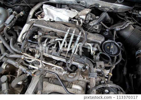 Modern ceramic glow plugs for diesel engines in cold weather in winter. Concept of breakdown and replacement of the heating element. Diesel engine preheater, industry Modern ceramic glow plugs for diesel engines in cold weather in winter. Concept of breakdown and replacement of the heating element. Diesel engine preheater, industry 113370317