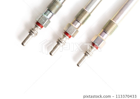 Rod ceramic glow plugs for a diesel engine on a white background, close-up, isolate. Heating element Rod ceramic glow plugs for a diesel engine on a white background, close-up, isolate. Heating element 113370433
