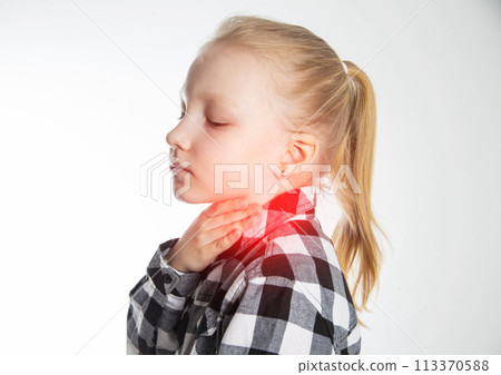 A blonde caucasian girl holds her sore red throat with her hands. Pain and inflammation in the throat in children. Inflammation of the tonsils and lymph nodes, asthma 113370588