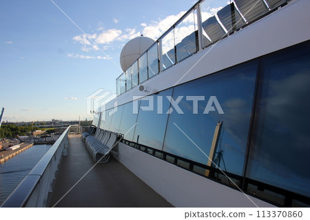 The upper deck of a large ocean-going tourist ship. 113370860