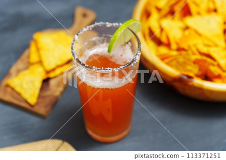 Michelada, Mexican alcoholic cocktail with beer, lime juice, tomato juice Michelada, Mexican alcoholic cocktail with beer, lime juice, tomato juice 113371251