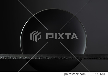 Black stone podium and black circle ceramic plate for luxury product placement. Black stone podium and black circle ceramic plate for luxury product placement. 113371681