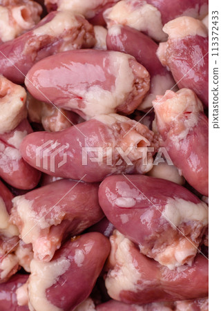 Raw chicken hearts with salt, spices and herbs Raw chicken hearts with salt, spices and herbs 113372433
