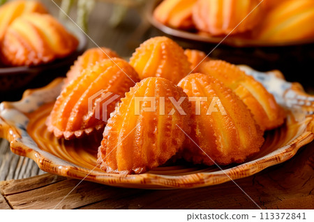 Classic French madeleine cookies, buttery and delicate, mini sponge cake baked in scallop mold 113372841
