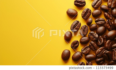 Coffee beans on a vibrant yellow background, creating a cozy cafe ambiance. 113373499