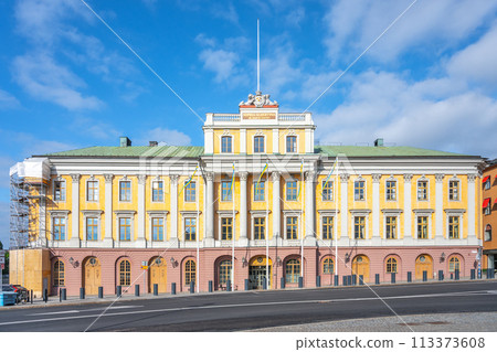 The Palace of the Hereditary Prince, Swedish: Arvfurstens Palats, stands bathed in sunlight, showcasing its elegant facade and classic architecture at the Gustav Adolfs Torg in Stockholm, Sweden 113373608