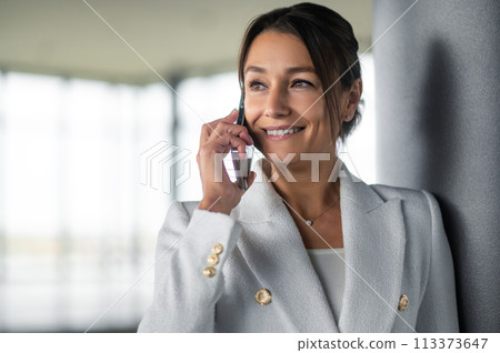 Cute stylish woman with a phone in hands 113373647