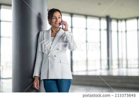 Cute stylish woman with a phone in hands 113373648