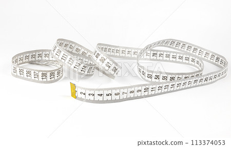 A measuring tape used by tailors for sewing clothes. Sewing concept. 113374053