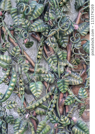 The pea plant is wrought iron as a background 113374169
