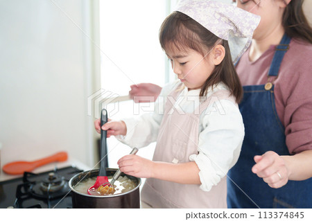 Girl and mother making miso soup 113374845